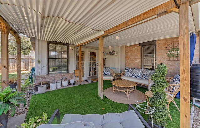 view of patio / terrace featuring fence and an outdoor hangout area