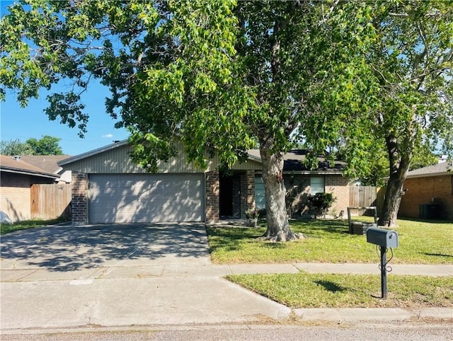 4006 Hurlwood, Corpus Christi, TX 78410 - view of front facade with brick siding, a garage, and concrete driveway