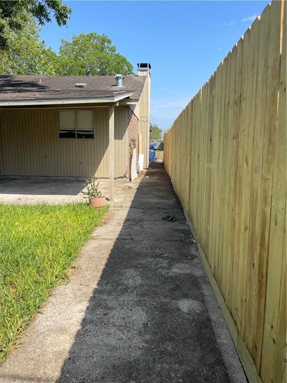 4006 Hurlwood, Corpus Christi, TX 78410 - view of home's exterior with roof with shingles and a chimney