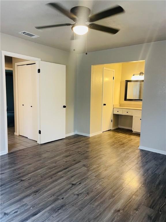 4006 Hurlwood, Corpus Christi, TX 78410 - unfurnished living room with ceiling fan, dark wood finished floors, and baseboards