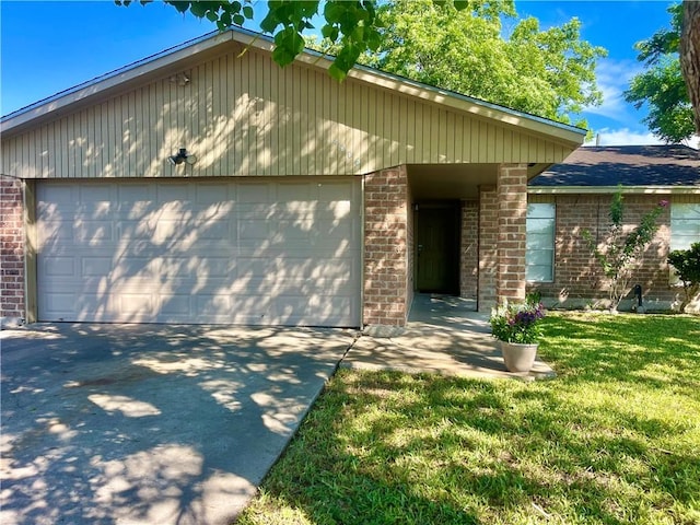 4006 Hurlwood, Corpus Christi, TX 78410 - mid-century inspired home with brick siding, a front lawn, driveway, and an attached garage