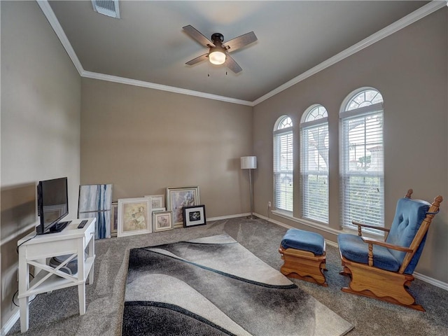 home office with crown molding, carpet flooring, baseboards, and ceiling fan