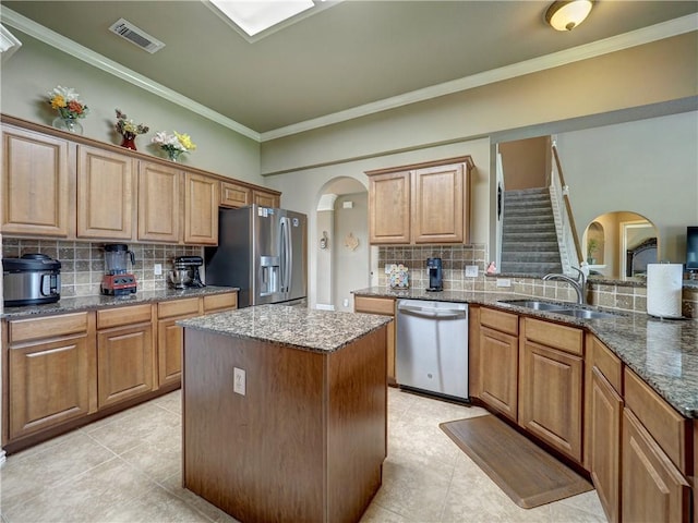 7509 Rancho Vis, Corpus Christi, TX 78414 - kitchen featuring a sink, appliances with stainless steel finishes, tasteful backsplash, and visible vents