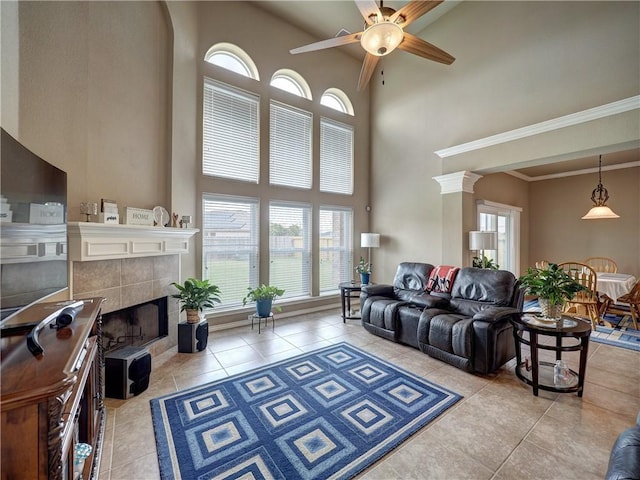 7509 Rancho Vis, Corpus Christi, TX 78414 - tiled living room with plenty of natural light, a towering ceiling, a fireplace, and ceiling fan