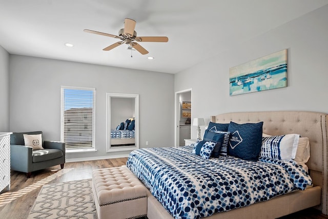 bedroom with a ceiling fan, recessed lighting, and wood finished floors