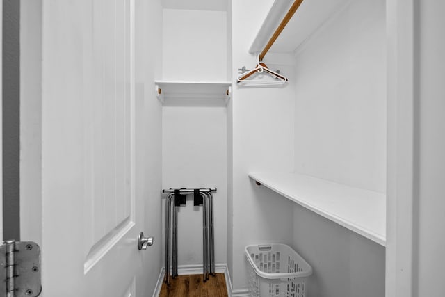 walk in closet featuring dark wood-style flooring