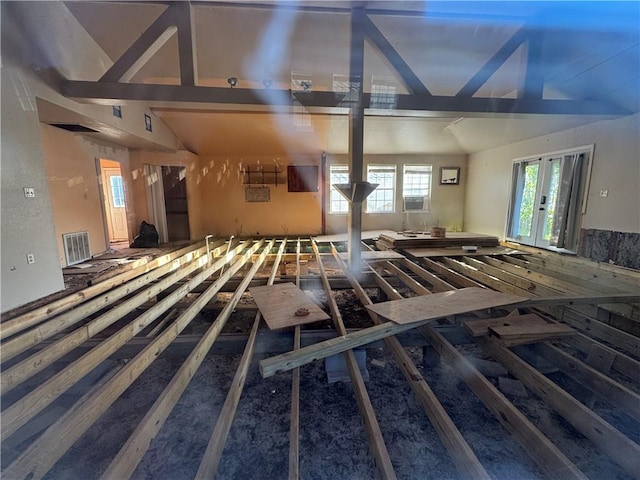 misc room with vaulted ceiling and french doors