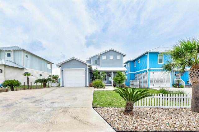 145 Beachwalk Prt, Aransas, TX 78373 - view of front of property with concrete driveway and an attached garage