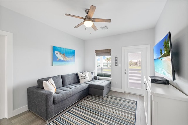 145 Beachwalk Prt, Aransas, TX 78373 - living area featuring light wood-style floors and ceiling fan
