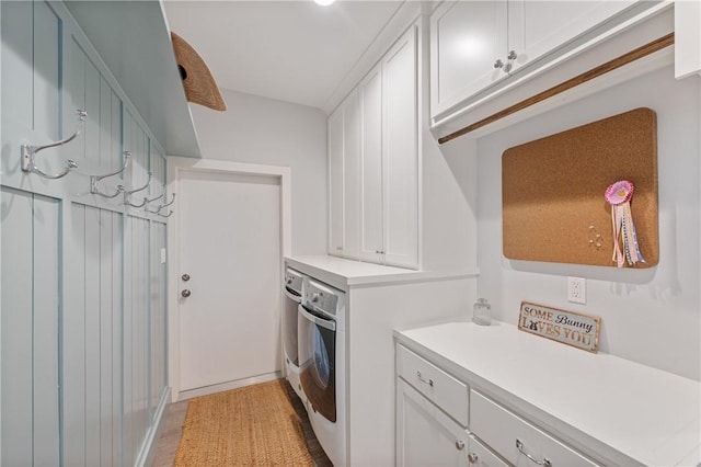 145 Beachwalk Prt, Aransas, TX 78373 - washroom with washing machine and dryer and cabinet space