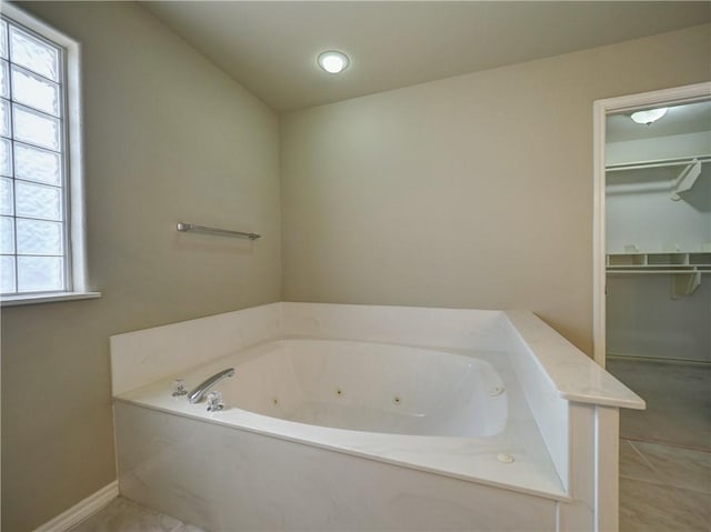 bathroom featuring a bathing tub and tile patterned flooring