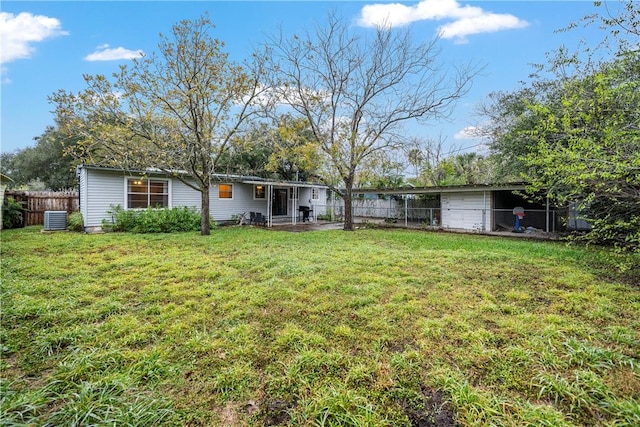 view of yard with cooling unit and a patio area