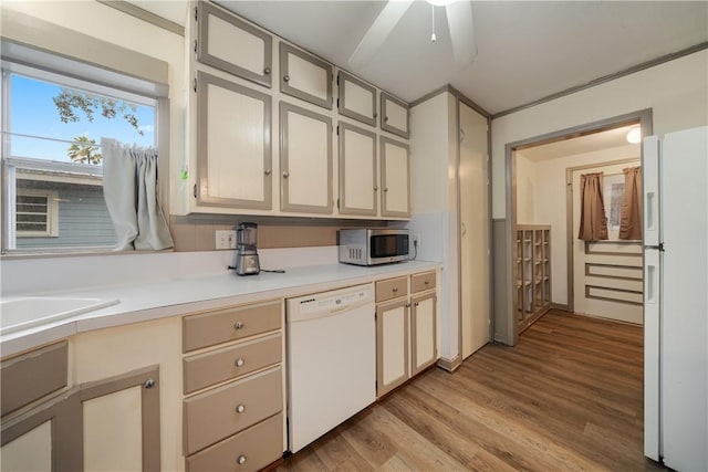 kitchen featuring white appliances, ceiling fan, and light hardwood / wood-style floors