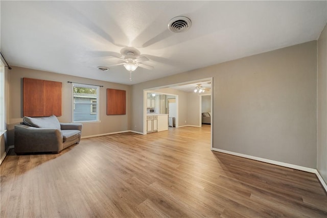 unfurnished room with ceiling fan and light hardwood / wood-style floors