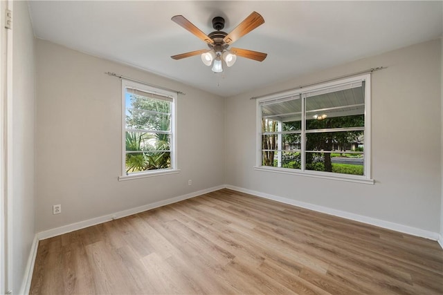 spare room featuring ceiling fan and light hardwood / wood-style floors