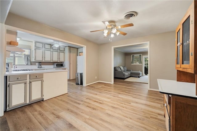 kitchen featuring white refrigerator, ceiling fan, and light hardwood / wood-style flooring