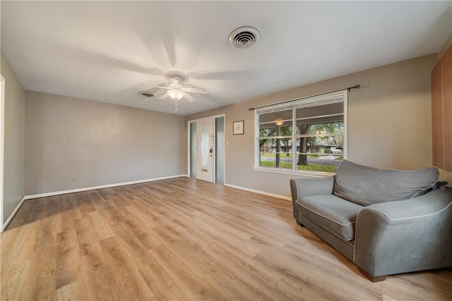 unfurnished room with light hardwood / wood-style floors and ceiling fan