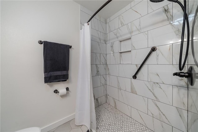 bathroom featuring tile patterned flooring and curtained shower