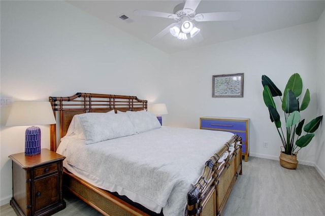 bedroom with ceiling fan and light hardwood / wood-style floors