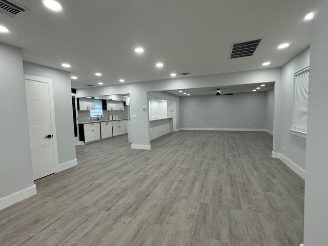 basement featuring light hardwood / wood-style flooring