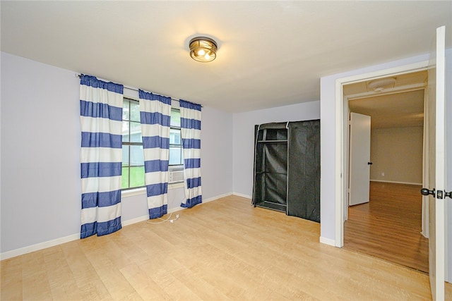 empty room with light hardwood / wood-style floors