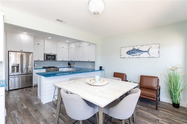 15354 Caravel Dr, Corpus Christi, TX 78418 - dining area featuring dark wood-type flooring and recessed lighting