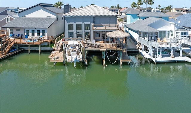 15354 Caravel Dr, Corpus Christi, TX 78418 - dock featuring stairway, a deck with water view, a residential view, and boat lift