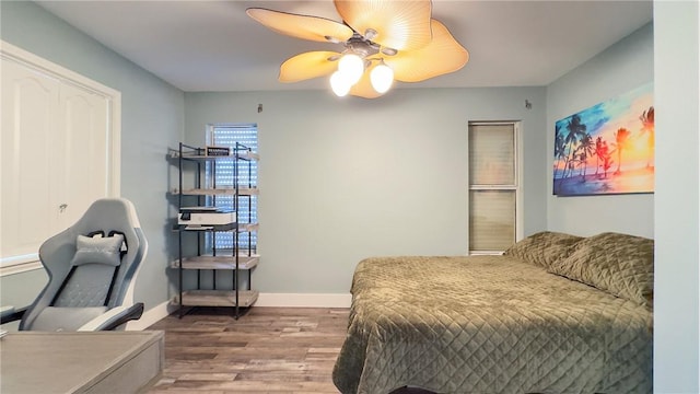 15354 Caravel Dr, Corpus Christi, TX 78418 - bedroom featuring wood finished floors, baseboards, and a ceiling fan