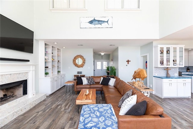 15354 Caravel Dr, Corpus Christi, TX 78418 - living area with a towering ceiling, wood finished floors, and a premium fireplace