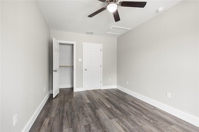 936 S 10th St, Aransas Pass, TX 78336 - unfurnished bedroom with wood finished floors, attic access, a closet, visible vents, and baseboards