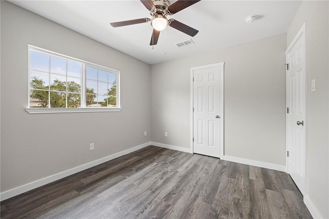 936 S 10th St, Aransas Pass, TX 78336 - unfurnished bedroom with baseboards, a ceiling fan, visible vents, and wood finished floors