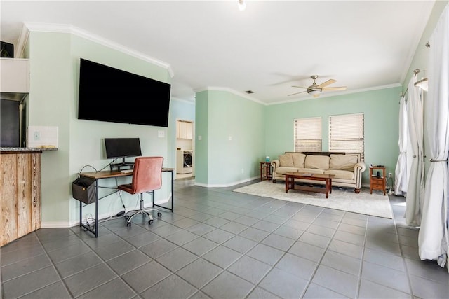 home office featuring washer / dryer, ceiling fan, ornamental molding, and dark tile patterned flooring