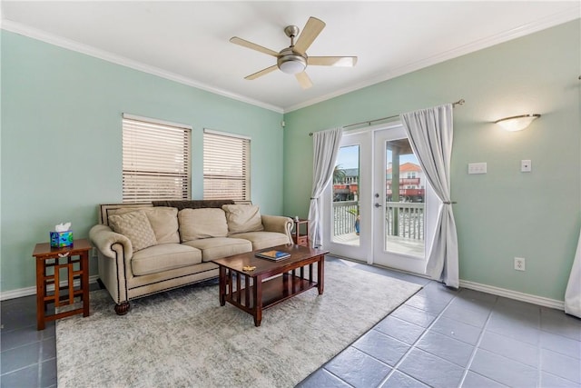 living room featuring french doors, crown molding, and baseboards