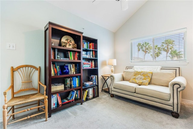 sitting room with vaulted ceiling, ceiling fan, carpet, and baseboards