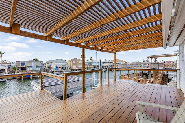 dock area with a water view and a pergola