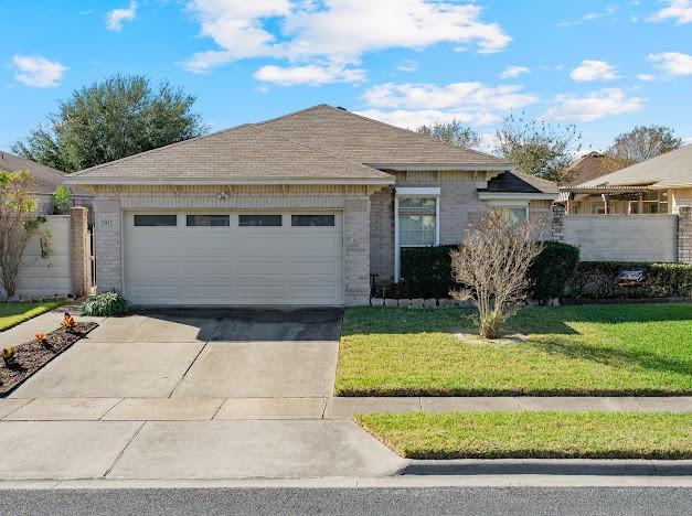 ranch-style house with a front lawn and a garage