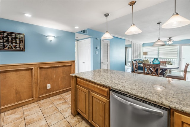 kitchen with decorative light fixtures, light tile patterned floors, light stone countertops, stainless steel dishwasher, and ceiling fan