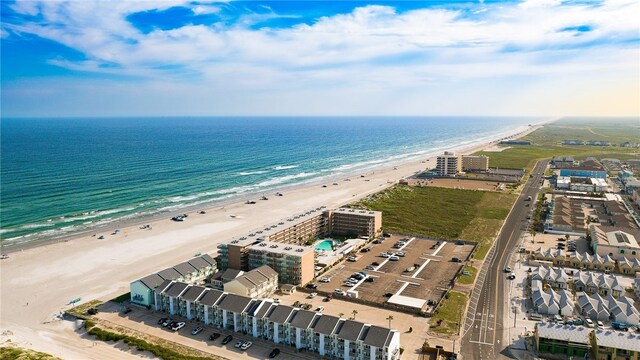 birds eye view of property with a beach view and a water view