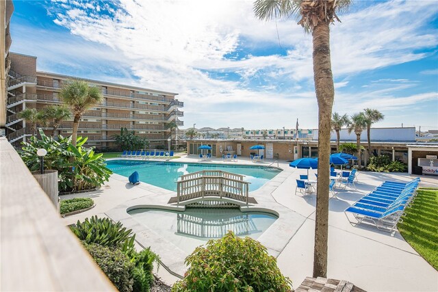 view of swimming pool featuring a patio