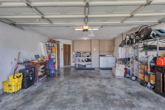 garage with a garage door opener and washing machine and clothes dryer