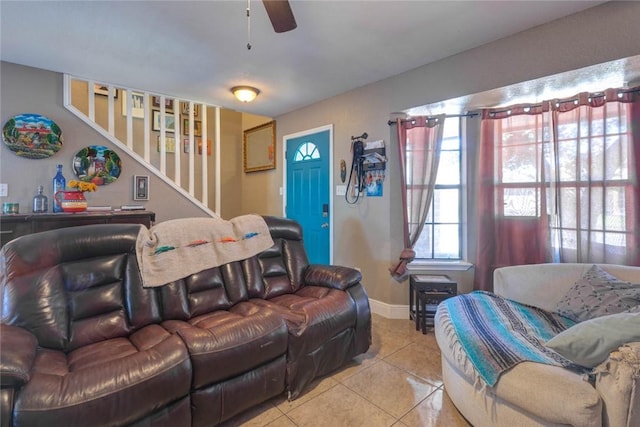 living room featuring ceiling fan and light tile patterned floors