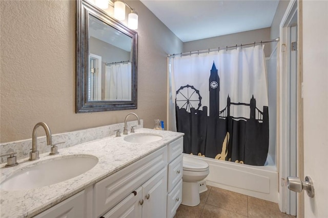 full bathroom featuring toilet, tile patterned flooring, vanity, and shower / tub combo with curtain