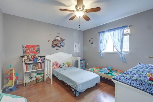 bedroom featuring ceiling fan and wood-type flooring