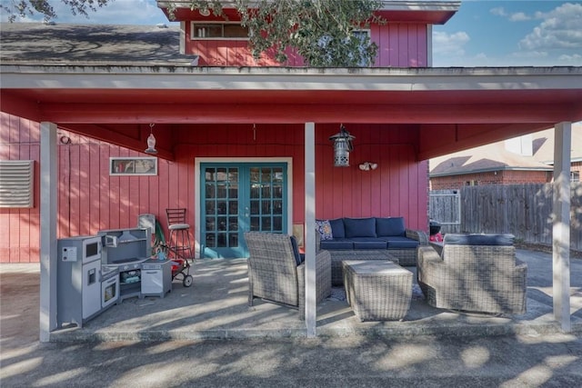 view of patio with an outdoor living space and french doors