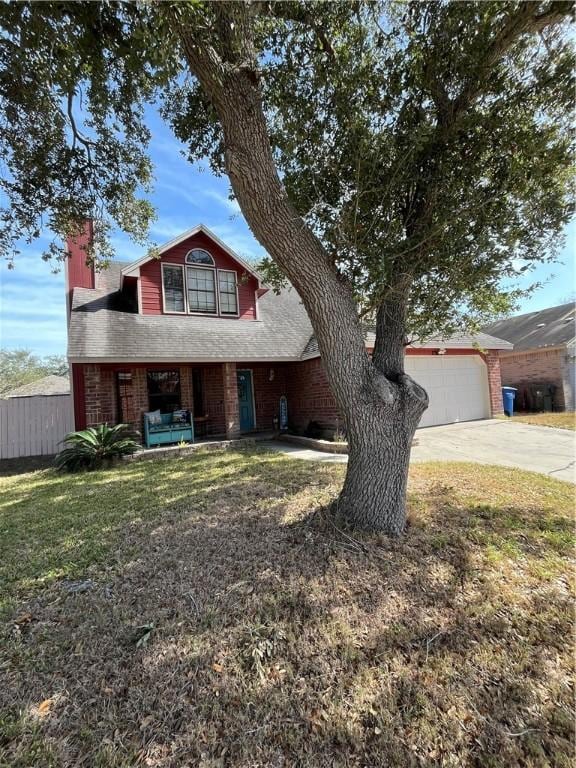 view of front of home featuring a garage and a front yard