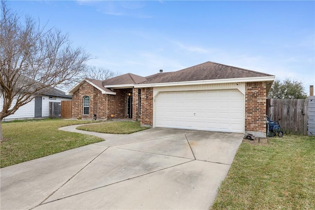 ranch-style home with an attached garage, brick siding, fence, driveway, and a front lawn