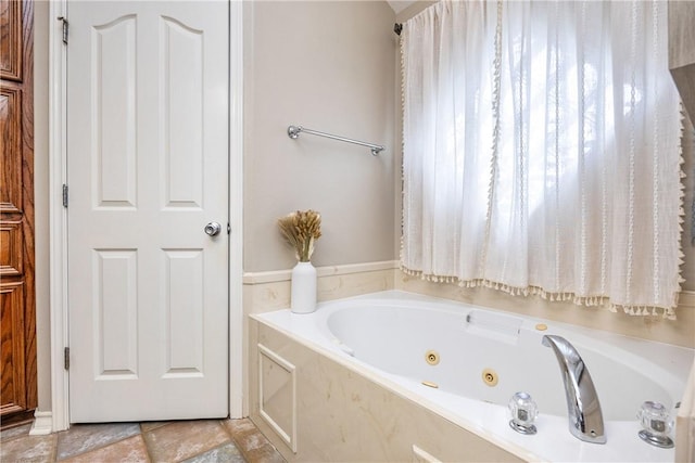 bathroom featuring a whirlpool tub