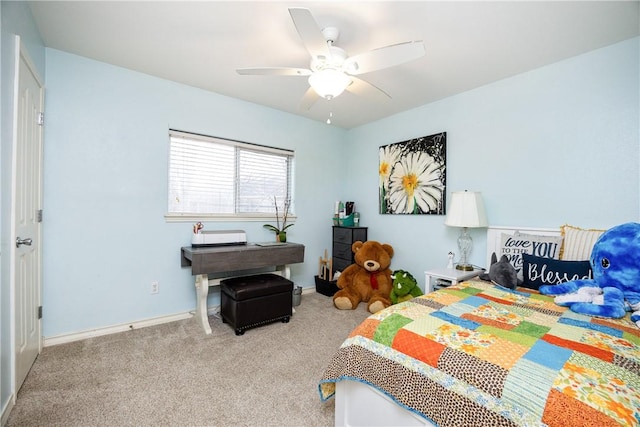 bedroom with light colored carpet, ceiling fan, and baseboards