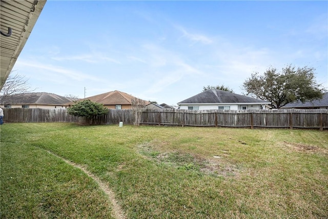 view of yard with a fenced backyard