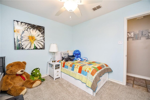 bedroom with carpet floors, visible vents, baseboards, and a ceiling fan